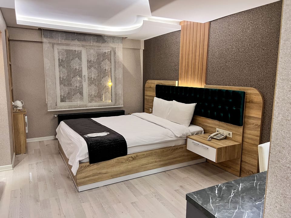 Double Room | Minibar (some free items), desk, iron/ironing board (on request)