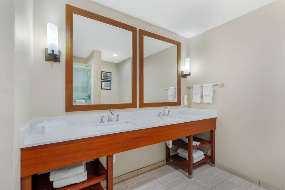 Suite, 2 Queen Beds, Non Smoking | Bathroom | Rainfall showerhead, free toiletries, hair dryer, towels