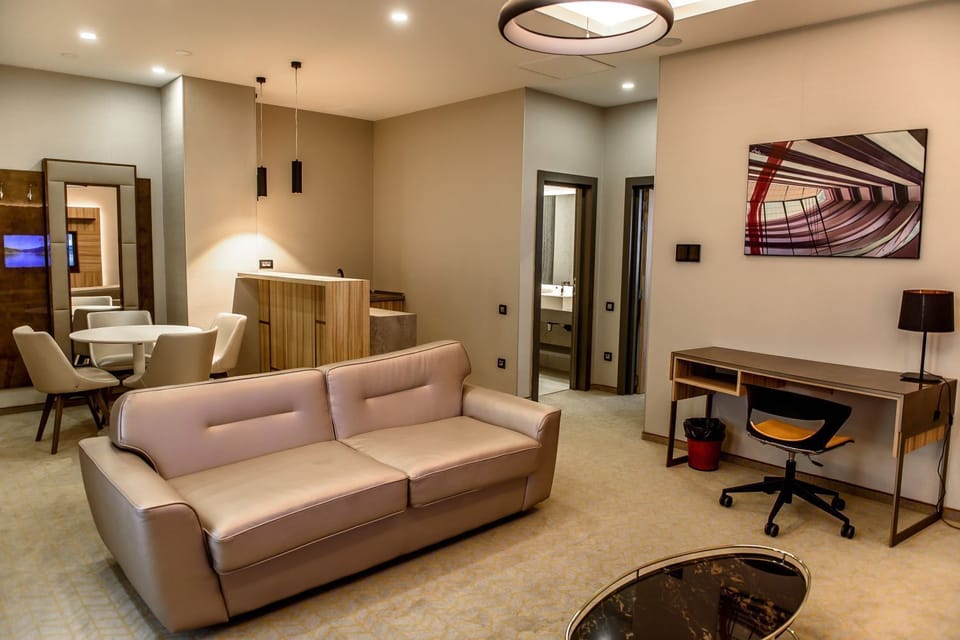 Suite, 1 King Bed, Non Smoking | Living area | 40-inch LCD TV with cable channels, TV