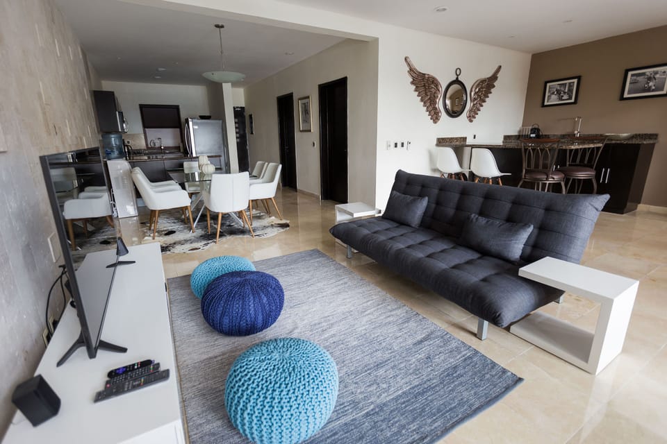 Deluxe Apartment | Living room | Flat-screen TV