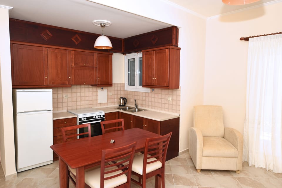 Apartment, 2 Bedrooms, Sea View (01) | Private kitchen | Full-size fridge, oven, stovetop, coffee/tea maker
