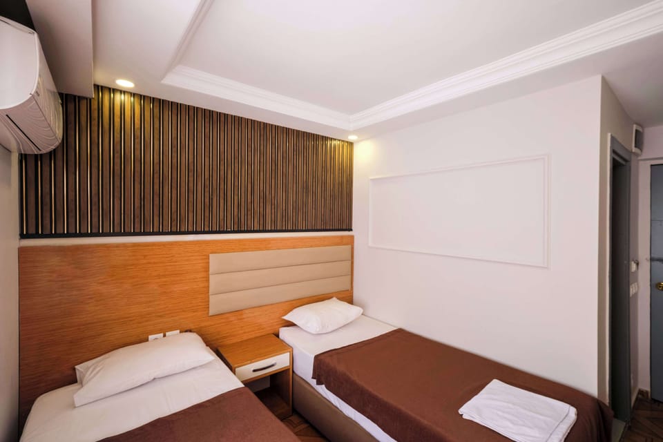Double or Twin Room | Minibar, in-room safe, blackout drapes, soundproofing