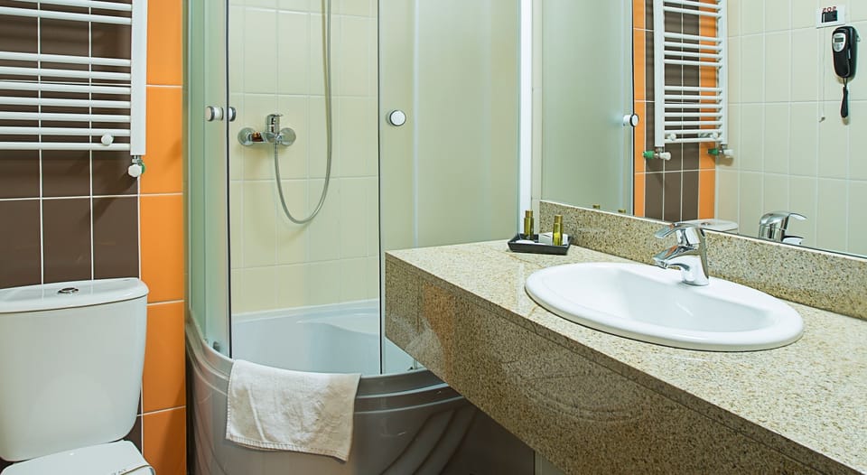 Shower, deep soaking tub, free toiletries, hair dryer