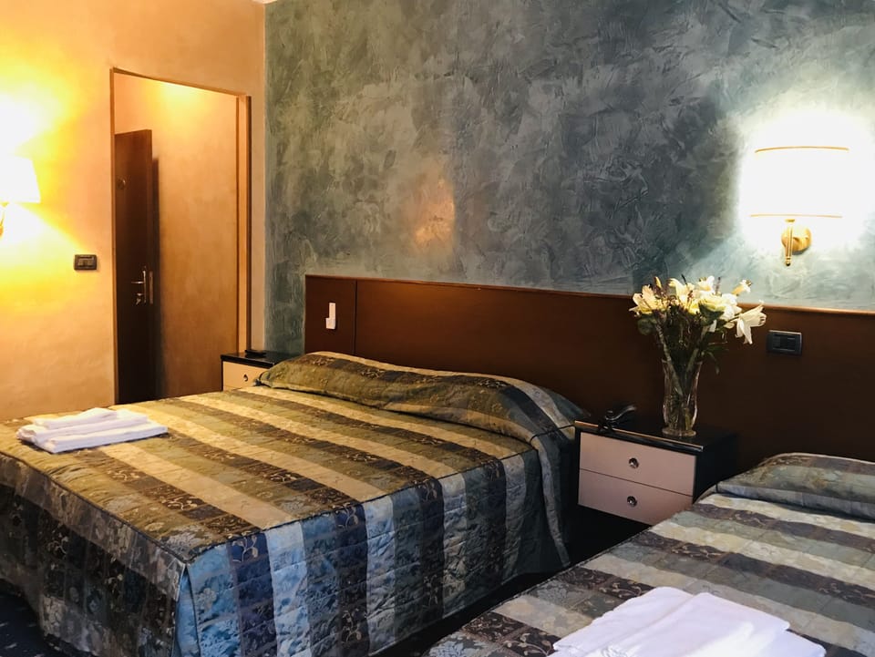 Triple Room | Desk, laptop workspace, blackout drapes, free WiFi