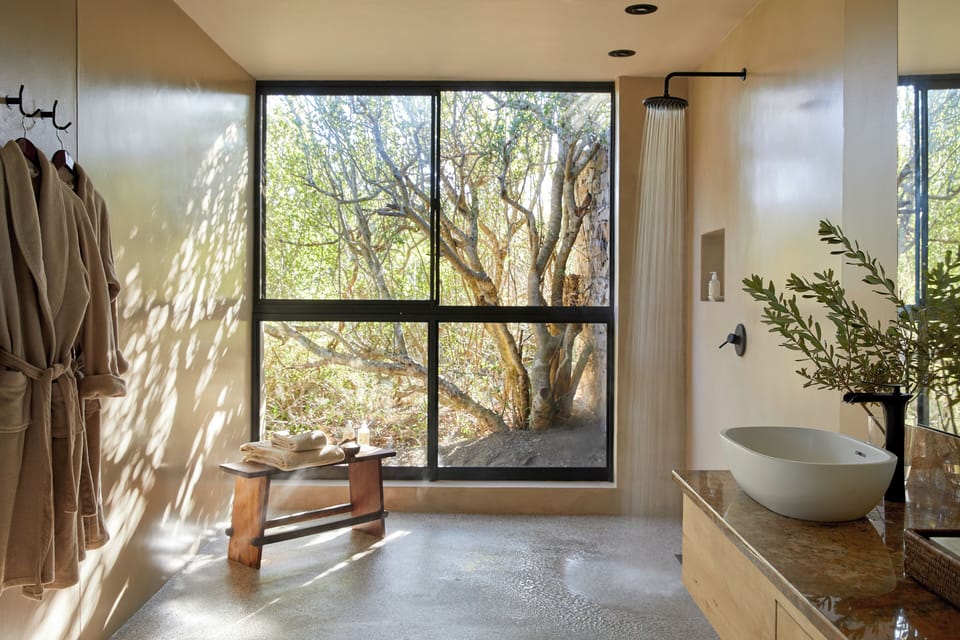 Separate tub and shower, hair dryer, slippers, towels