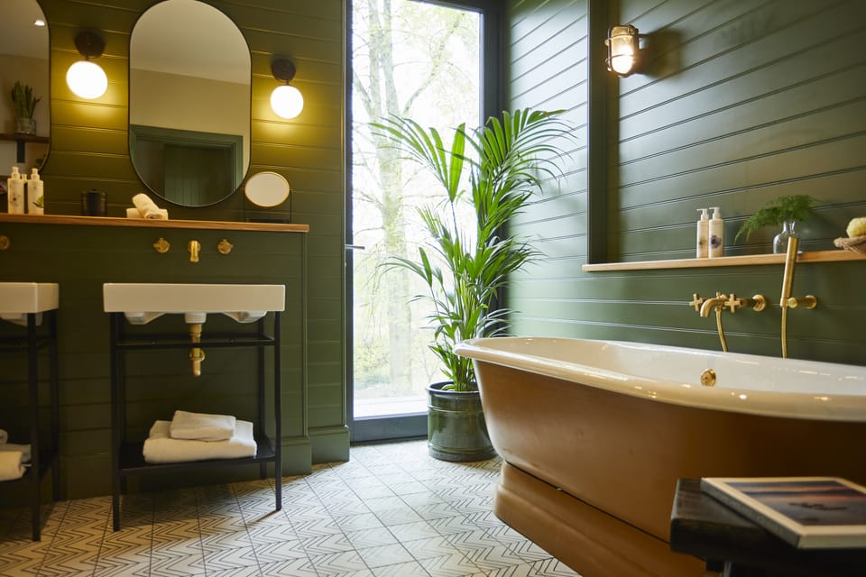 Separate tub and shower, rainfall showerhead, designer toiletries