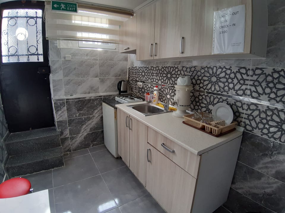 Family Triple Room, Basemant Floor | Private kitchen | Mini-fridge, electric kettle