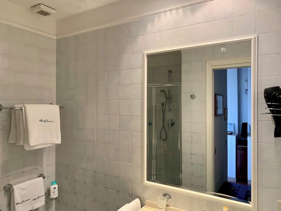Deluxe Double Room, Patio, Sea View | Bathroom | Shower, rainfall showerhead, designer toiletries, hair dryer