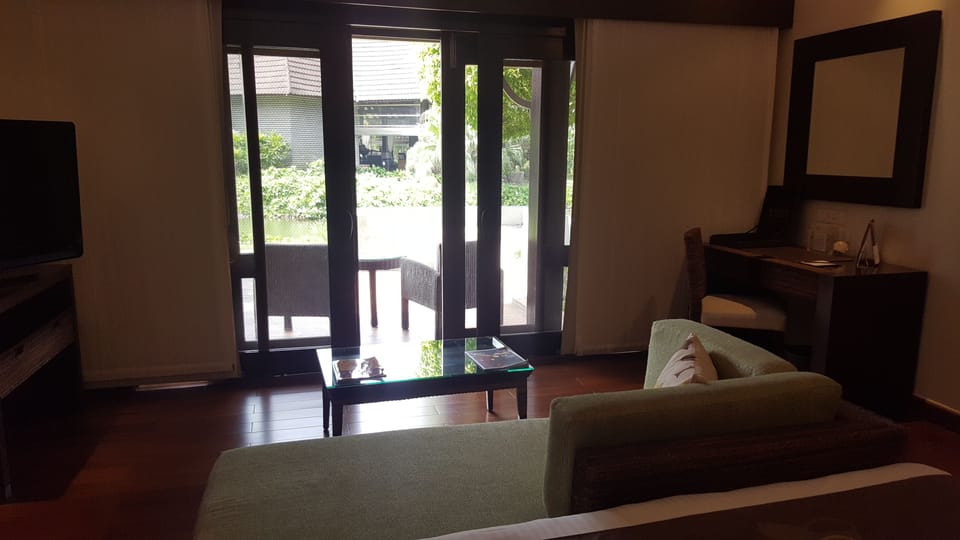 Deluxe Room, Lagoon View | Living area | 32-inch LCD TV with cable channels, TV, fireplace