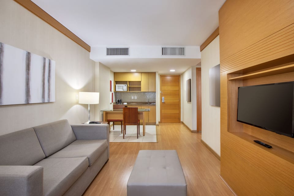 Standard Room, 1 King Bed | Living room | 32-inch Smart TV with satellite channels, TV, Netflix