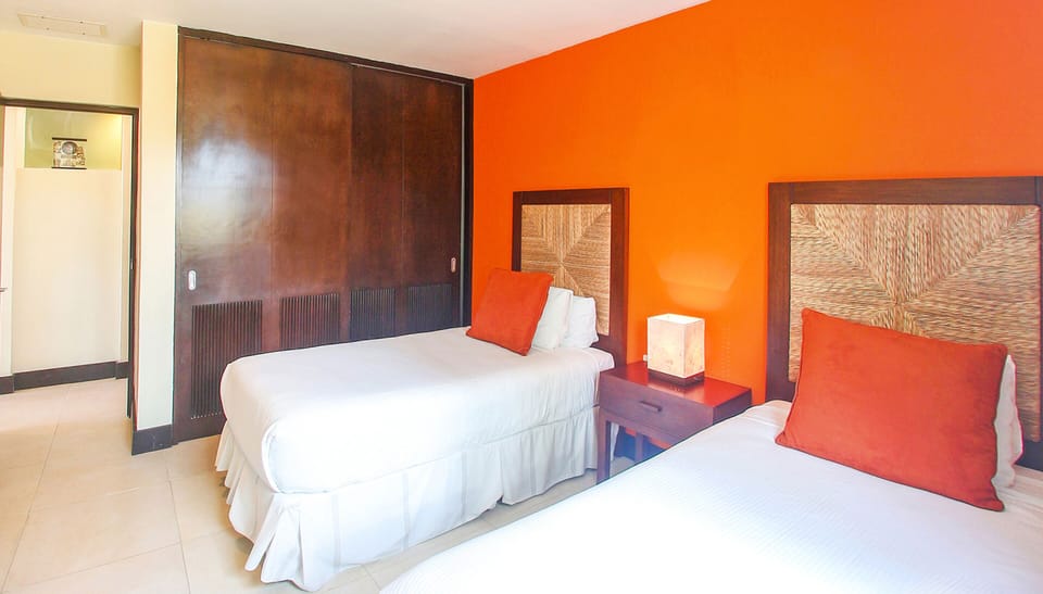 Deluxe Apartment, Kitchen, Pool View | 2 bedrooms, in-room safe, free WiFi, bed sheets
