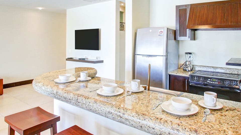 Deluxe Apartment, Kitchen, Pool View | Private kitchen | Full-size fridge, microwave, oven, stovetop