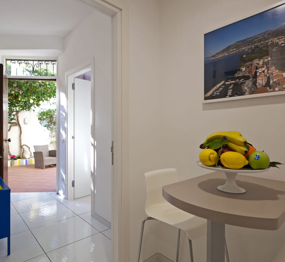 Apartment, 1 Queen Bed | Living area | 32-inch flat-screen TV with satellite channels, TV