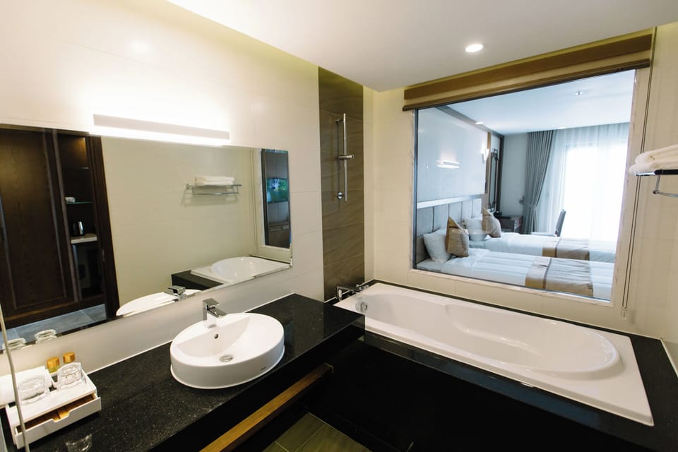 Deluxe Twin Room, Balcony, Hill View | Bathroom | Separate tub and shower, deep soaking tub, rainfall showerhead