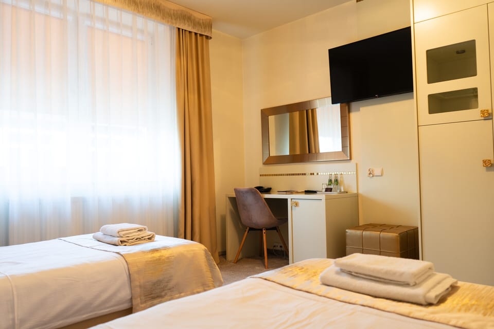 Family Room | Hypo-allergenic bedding, in-room safe, desk, iron/ironing board
