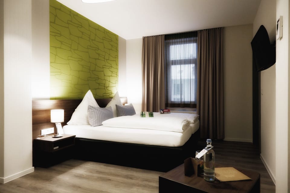 Family Room | Premium bedding, down comforters, in-room safe, desk