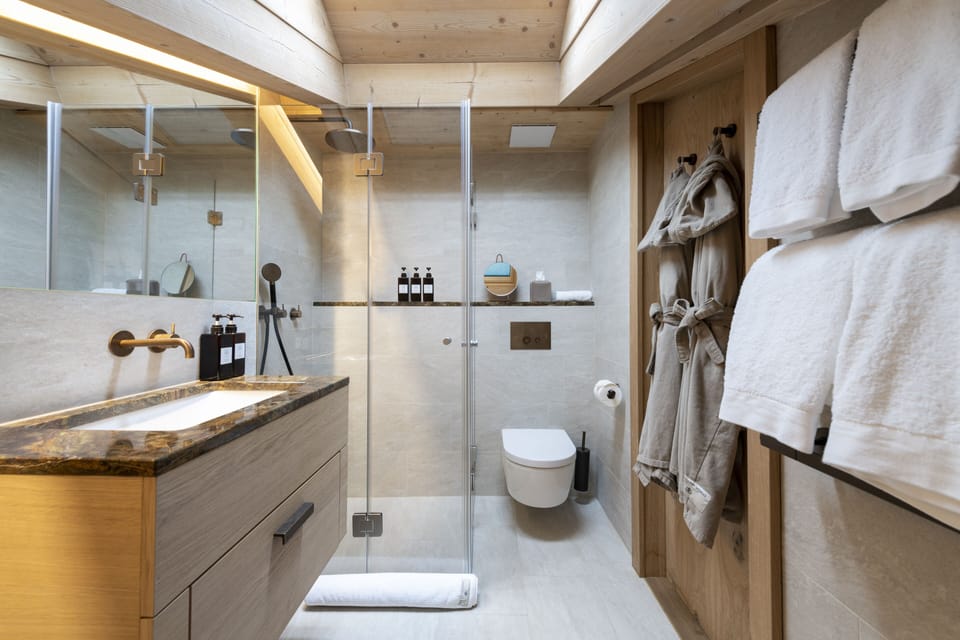Attic Deluxe | Bathroom | Shower, rainfall showerhead, eco-friendly toiletries, hair dryer