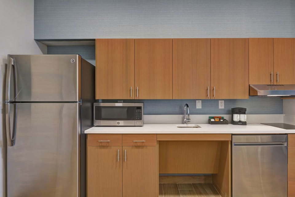 Studio, 1 King Bed, Accessible (Roll-In Shower) | Private kitchen | Full-size fridge, microwave, stovetop, dishwasher