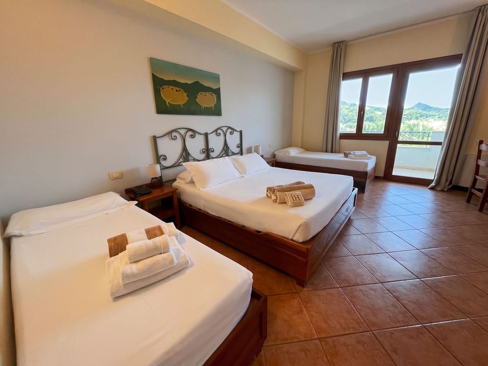 Standard Quadruple Room | Minibar, in-room safe, desk, soundproofing