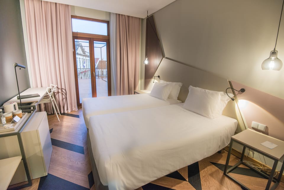 Premium Twin Room | Minibar, in-room safe, desk, blackout drapes
