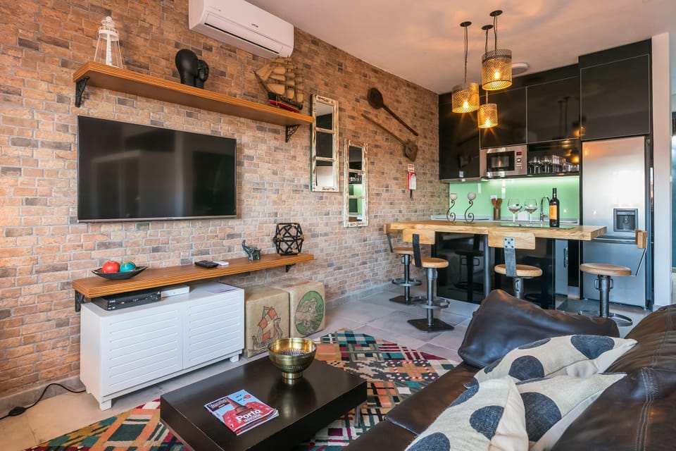 Family Apartment, 1 Bedroom, City View | Living room | 42-inch flat-screen TV with cable channels, TV
