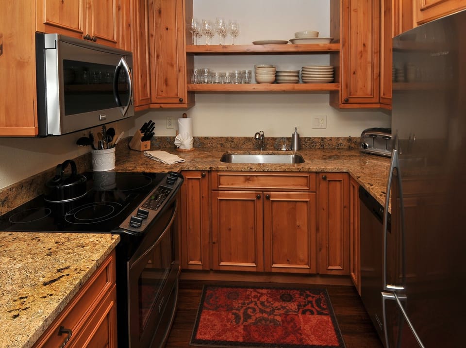 Condo, 2 Bedrooms | Private kitchen | Fridge, microwave, oven, dishwasher