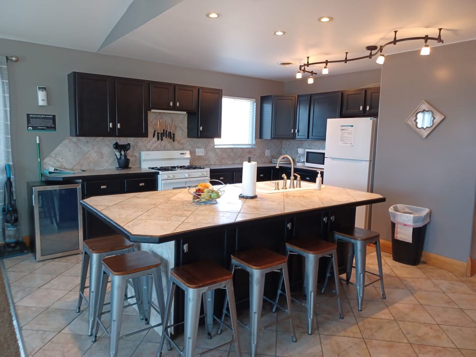 Penthouse Suite | Private kitchenette | Fridge, microwave, coffee/tea maker, toaster