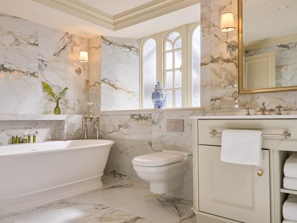 Viscount Stateroom | Bathroom | Separate tub and shower, eco-friendly toiletries, hair dryer, bathrobes