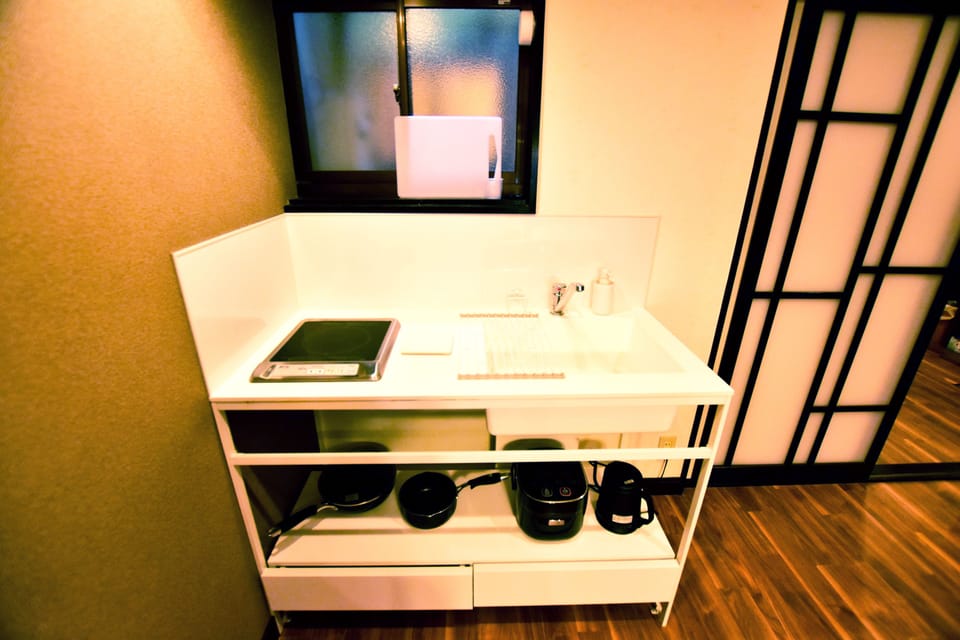 Japanese Style Townhouse | Private kitchenette | Fridge, microwave, cookware/dishes/utensils