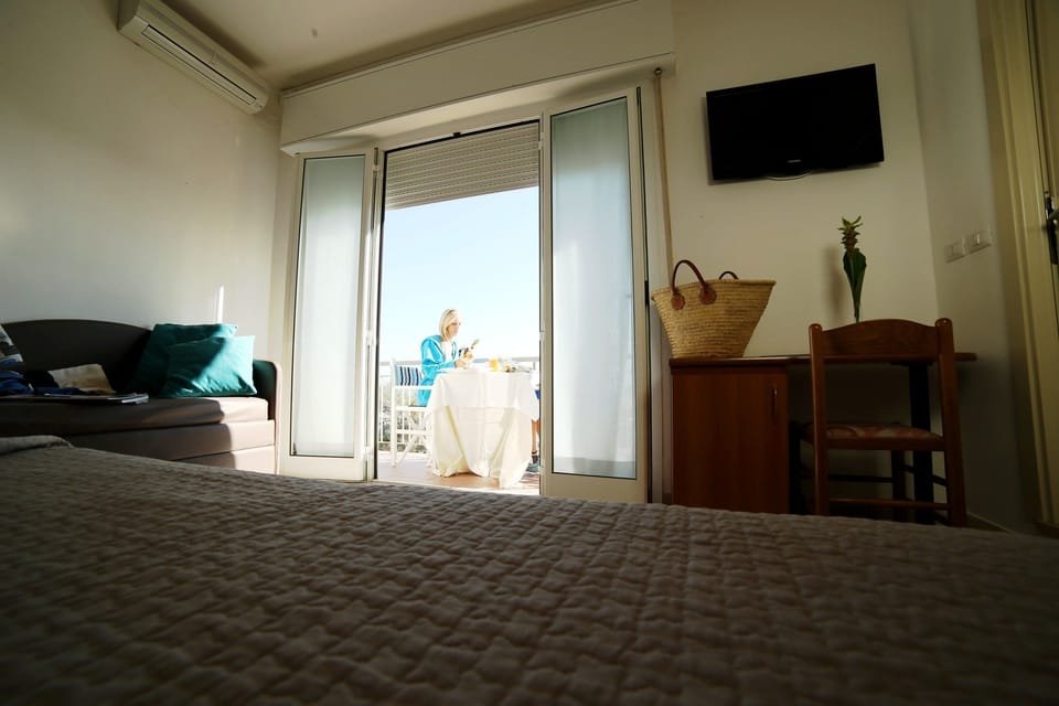 Superior Quadruple Room (Plus) | In-room safe, desk, WiFi, bed sheets