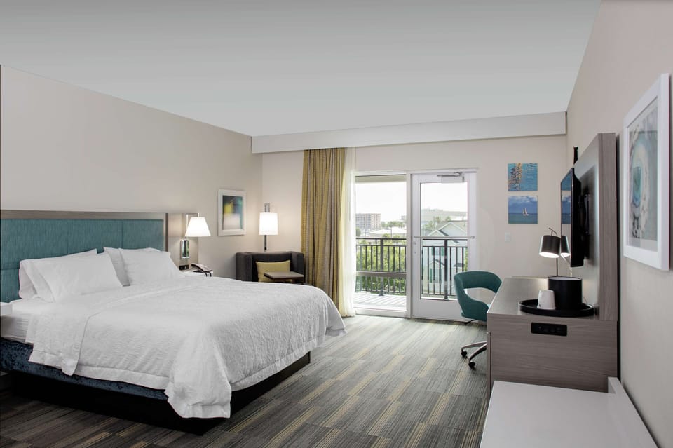 Premium bedding, desk, laptop workspace, iron/ironing board
