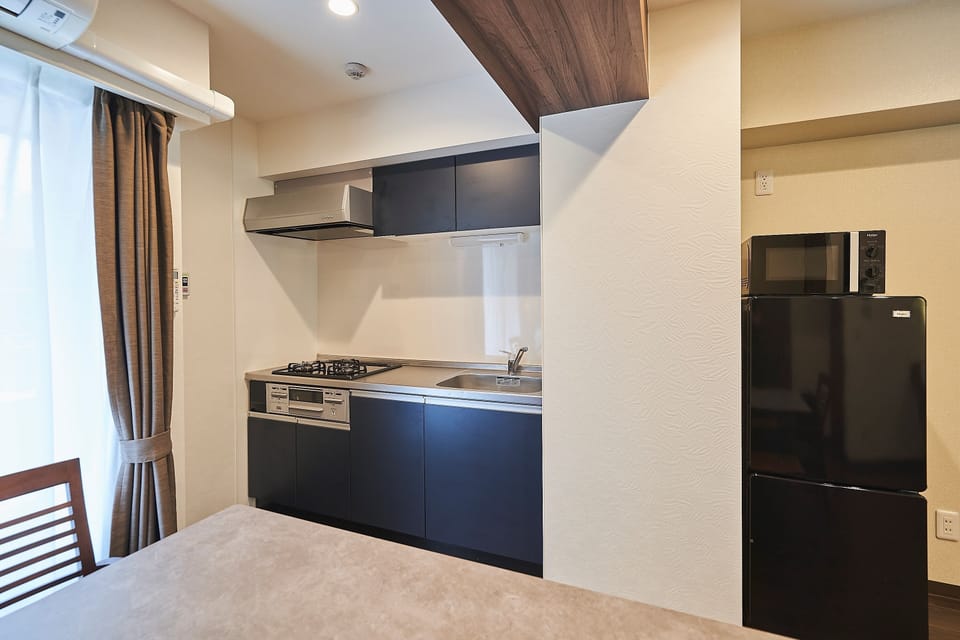 Family Condo, Non Smoking | Private kitchen | Full-size fridge, microwave, stovetop, electric kettle