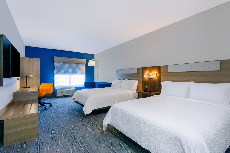 Suite, 2 Queen Beds | Desk, blackout drapes, iron/ironing board, rollaway beds