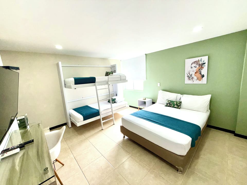 Standard Quadruple Room, Multiple Beds | Minibar, in-room safe, desk, laptop workspace