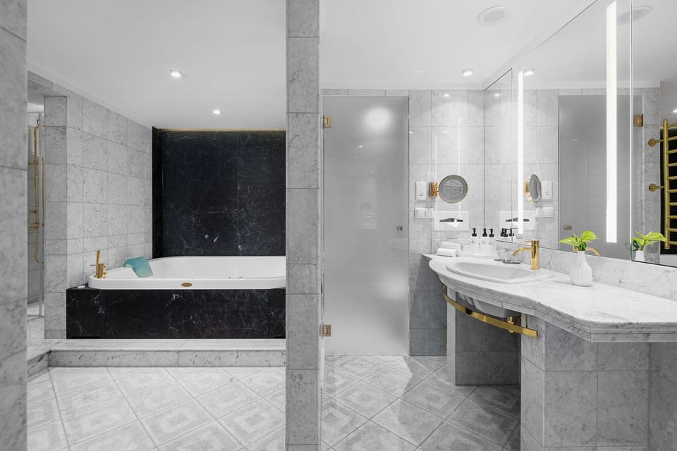 Suite, 1 King Bed, Sauna | Bathroom | Designer toiletries, hair dryer, bathrobes, slippers