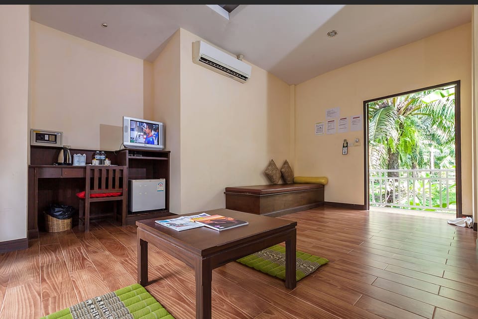 Deluxe Bungalow, Garden View | Minibar, in-room safe, desk, free WiFi