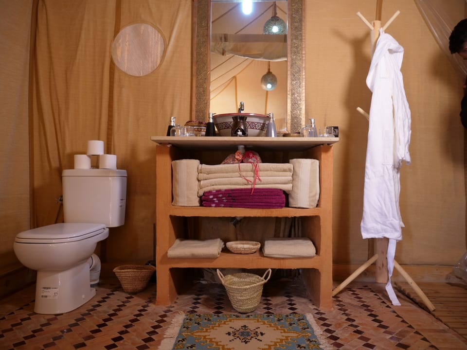 Shower, bathrobes, towels, toilet paper