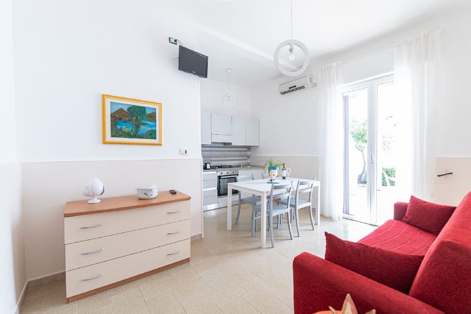 Comfort Apartment, 1 Bedroom, Patio | Living area | 32-inch flat-screen TV with digital channels