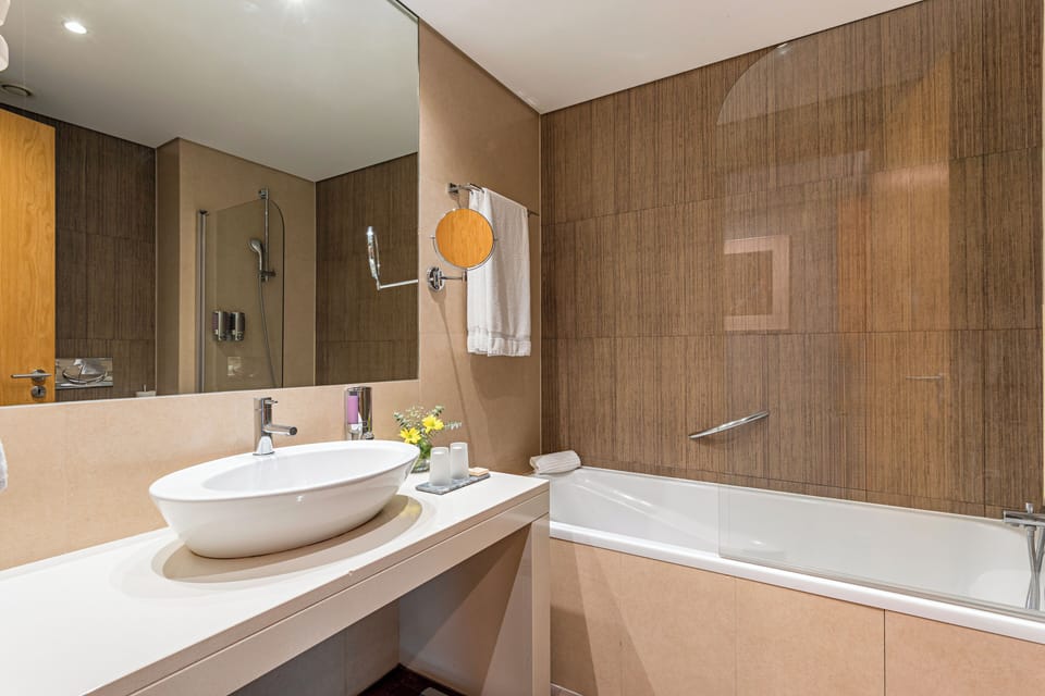 Bathtub, eco-friendly toiletries, hair dryer, bidet