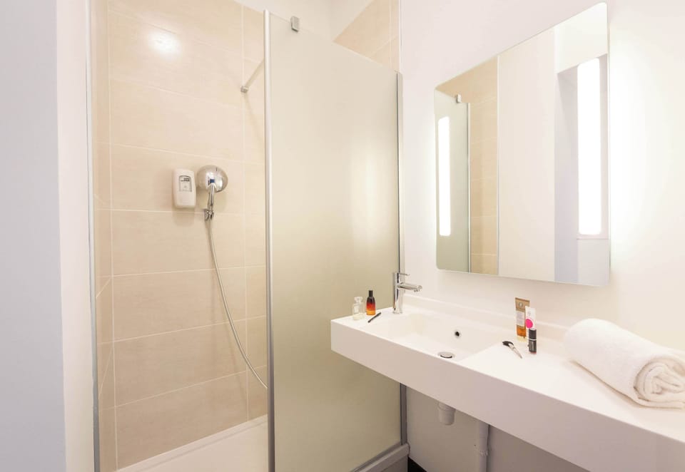 Shower, towels, soap, toilet paper