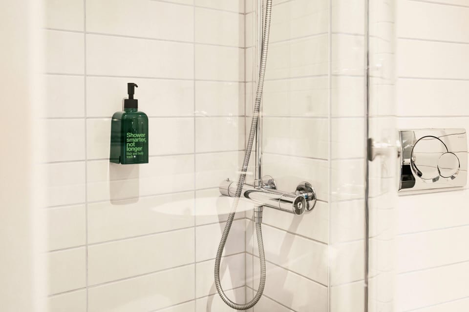 Room, 1 Queen Bed | Bathroom | Shower, rainfall showerhead, free toiletries, hair dryer
