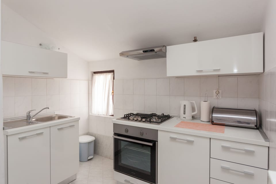 Standard Apartment, 2 Bedrooms, Balcony, Partial Sea View | Private kitchen | Full-size fridge, microwave, stovetop, coffee/tea maker