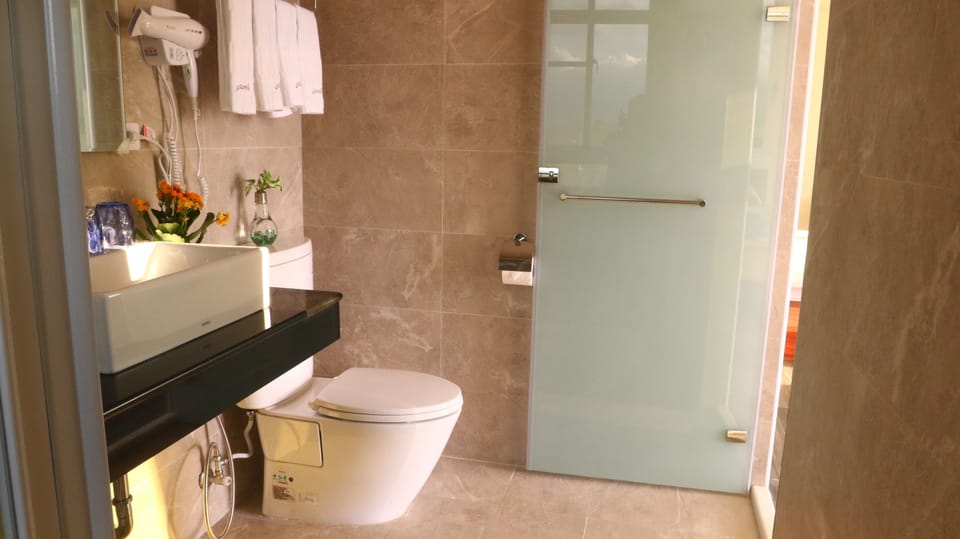 Shower, free toiletries, hair dryer, slippers