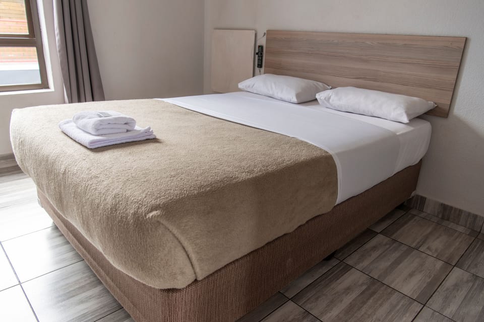 Standard Room | Living area | 30-inch flat-screen TV with satellite channels, TV