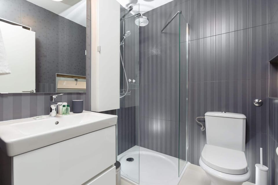 Shower, designer toiletries, hair dryer, bathrobes