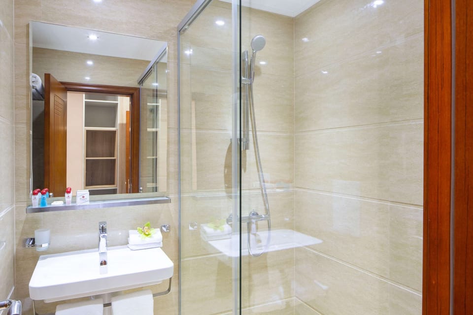Superior Apartment, 1 King Bed, Non Smoking, Kitchenette (Living Room) | Bathroom | Rainfall showerhead, eco-friendly toiletries, hair dryer, slippers