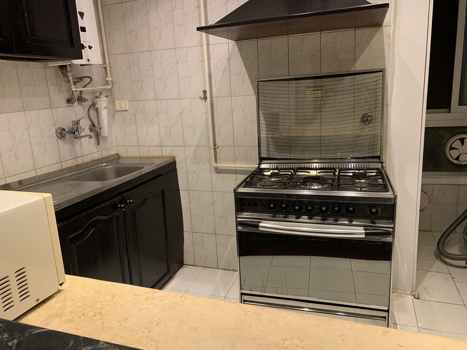 Elite Apartment | Private kitchen | Fridge, microwave, oven, stovetop