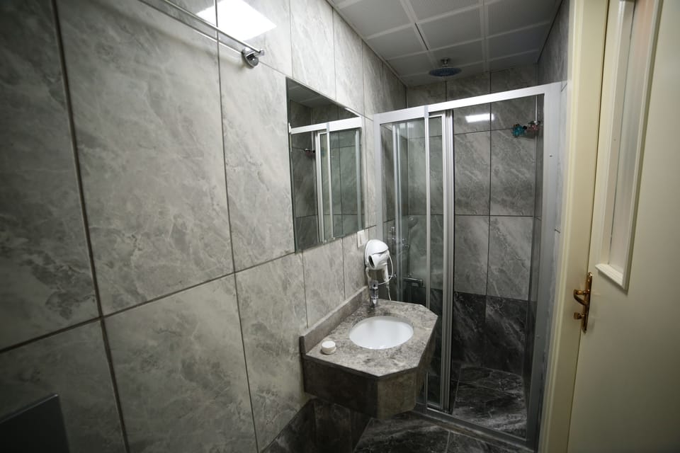 Shower, free toiletries, hair dryer, slippers