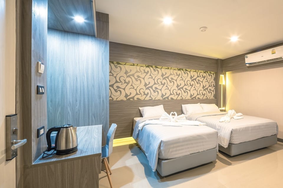 Triple Room with Balcony | In-room safe, desk, free WiFi, bed sheets