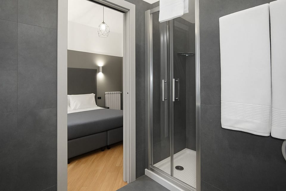 Deluxe Room, 1 Queen Bed, City View | Bathroom | Shower, rainfall showerhead, free toiletries, hair dryer